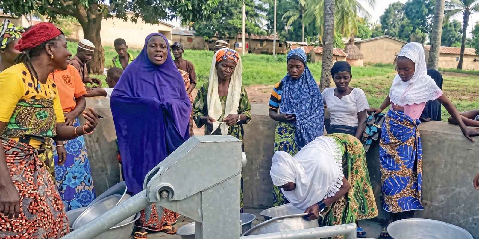 Women from the village of Sonaholou standing our the new water well.