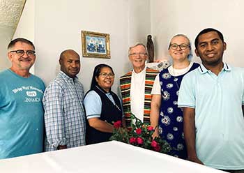 Father Bernard Latus and team working at a school in Jamaica.