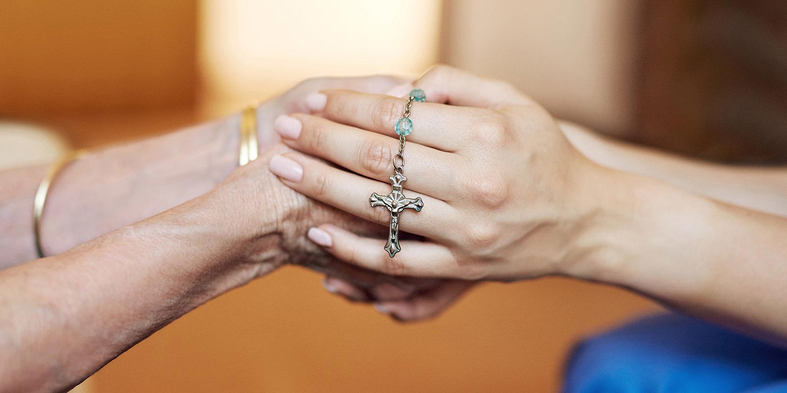 Holding hands with rosary
