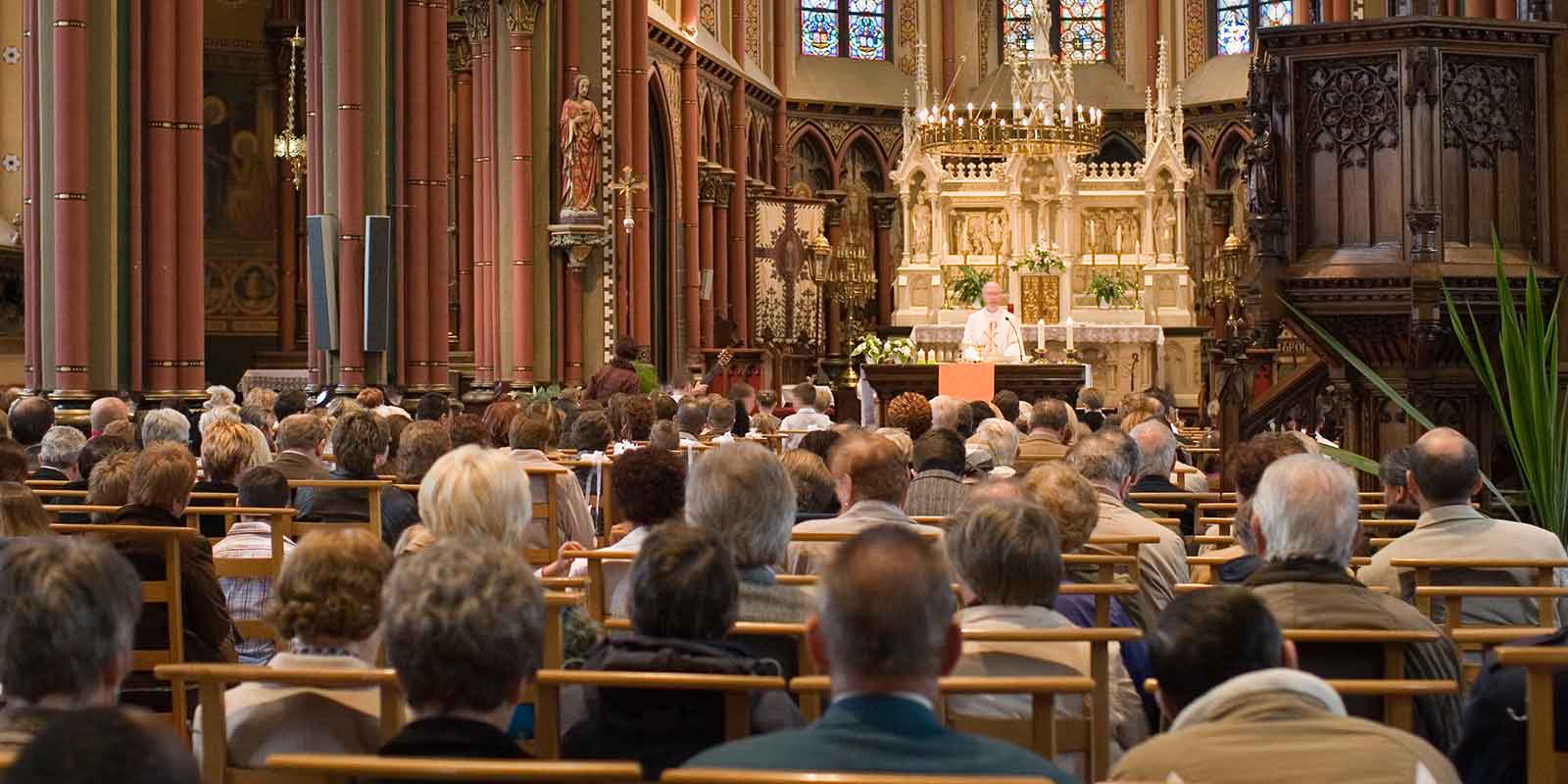 Mass being held in a Catholic church.