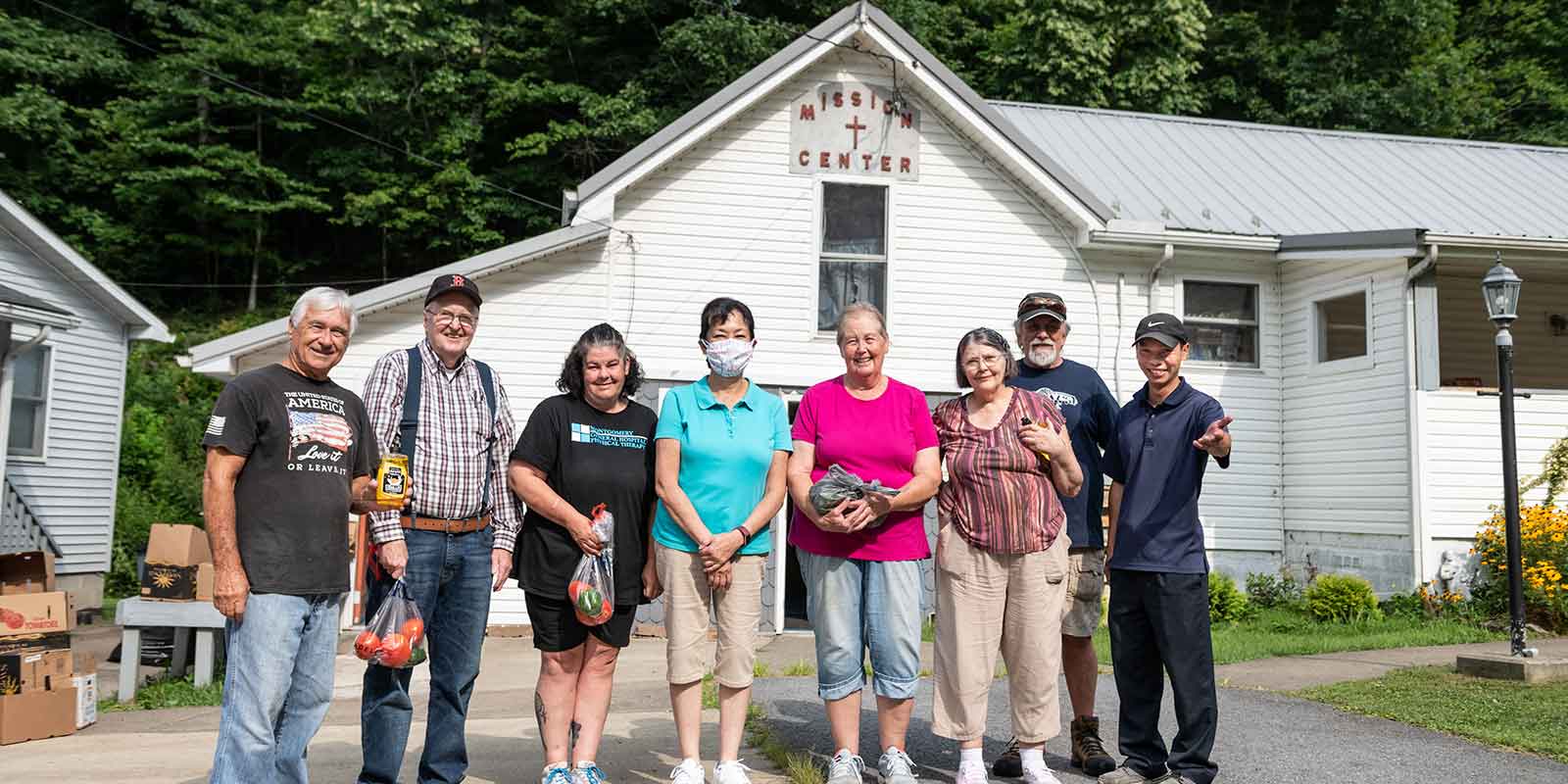 Volunteers in front of Risen Lord Food Bank in West Virginia
