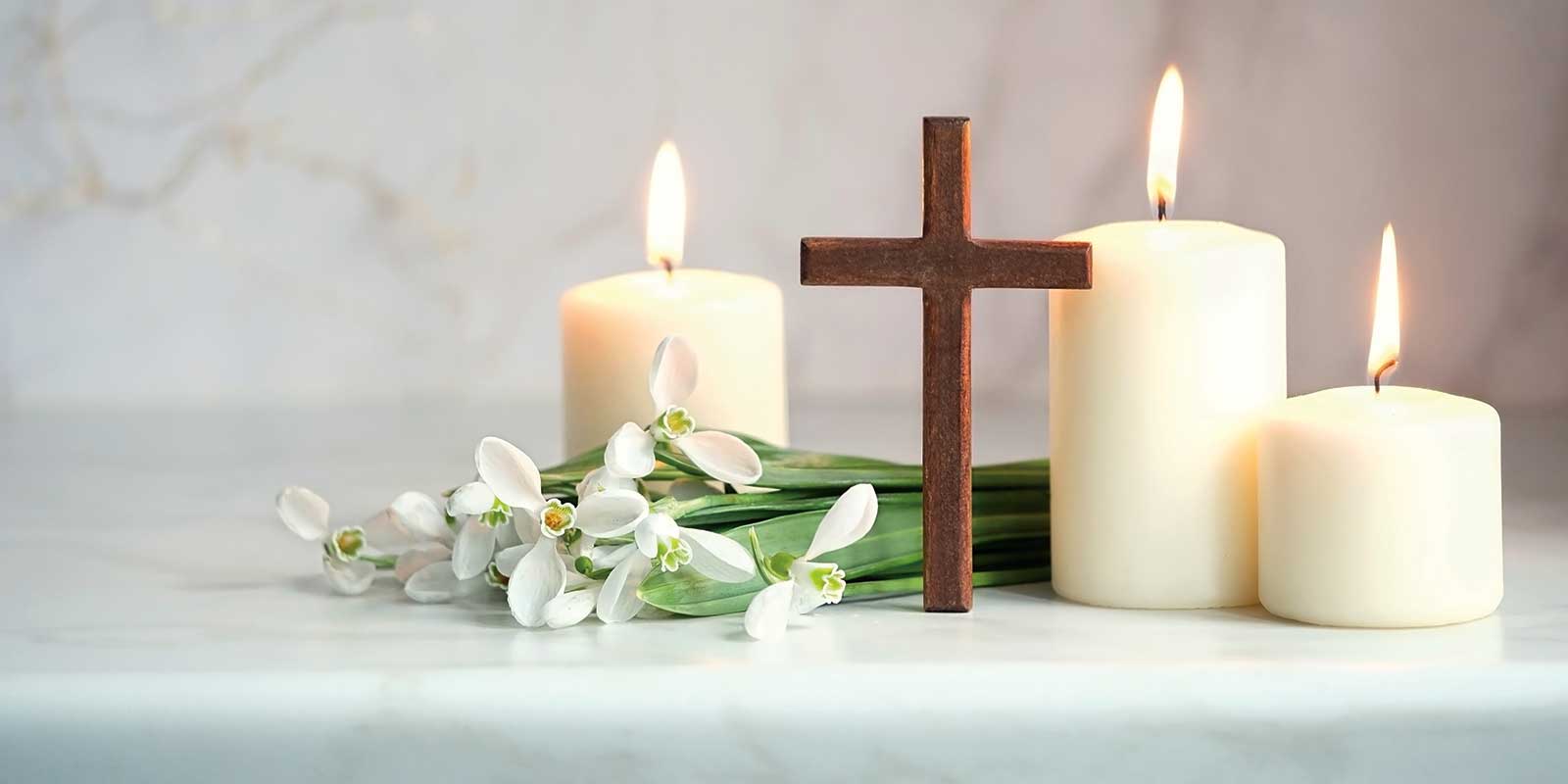 Easter Lillies and Candles with a Wooden Cross