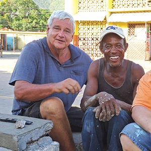 Brother Bernie visiting with a local resident in Jamaica