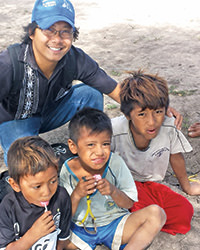 Father Lan Tu serving local resident children in Bahia Negra, Paraguay