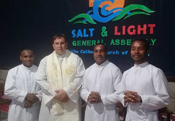 Father Michael Tomaszewski standing with Novices at the General Assembly of the Catholic Church in Papua New Guinea