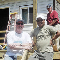 Father Matheus and a crew of volunteers help to repair a local church in Gassoway, West Virginia.