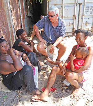 Brother Bernie visiting with locals in Jamaica