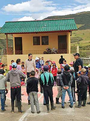 Khahn Ha with local children in Ludo, Ecuador